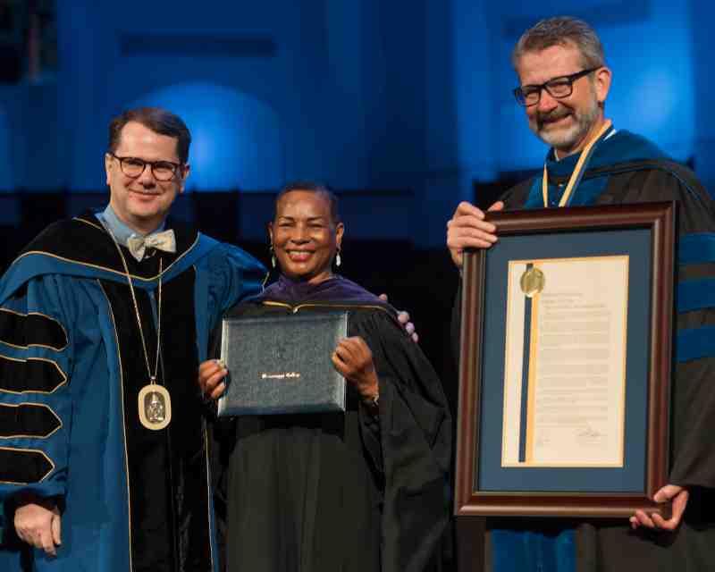 Dr. Regina Schofield, director of corporate engagement and education outreach for Battelle Education and an MC graduate, receives her honorary juris doctor from Mississippi College President Blake Thompson, left, and MC Law Interim Dean John Anderson.