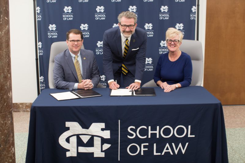 MC President Blake Thompson, MC Law Dean John Anderson, and The W President Nora Roberts Miller