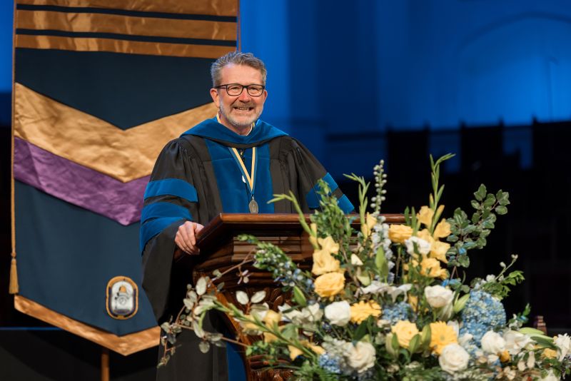 Dean John P. Anderson speaking at graduation.